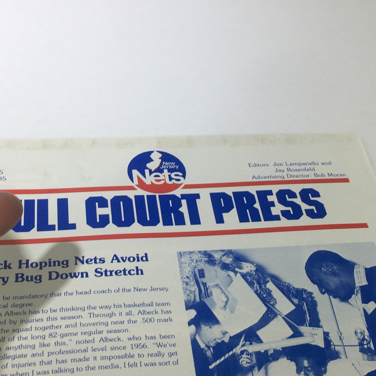 Close-up of the title section from 'Nets Full Court Press: February 1985 - Vol. 5 No. 5'. The image captures the vibrant design and branding of the New Jersey Nets along with editorial information.