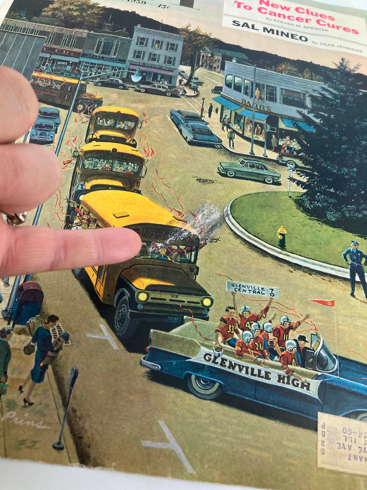Detailed view of The Saturday Evening Post cover, dated October 31, 1959, 'New Clues To Cancer Cures,' highlighting a town parade with children and vintage styled vehicles, finger pointing at the scene.