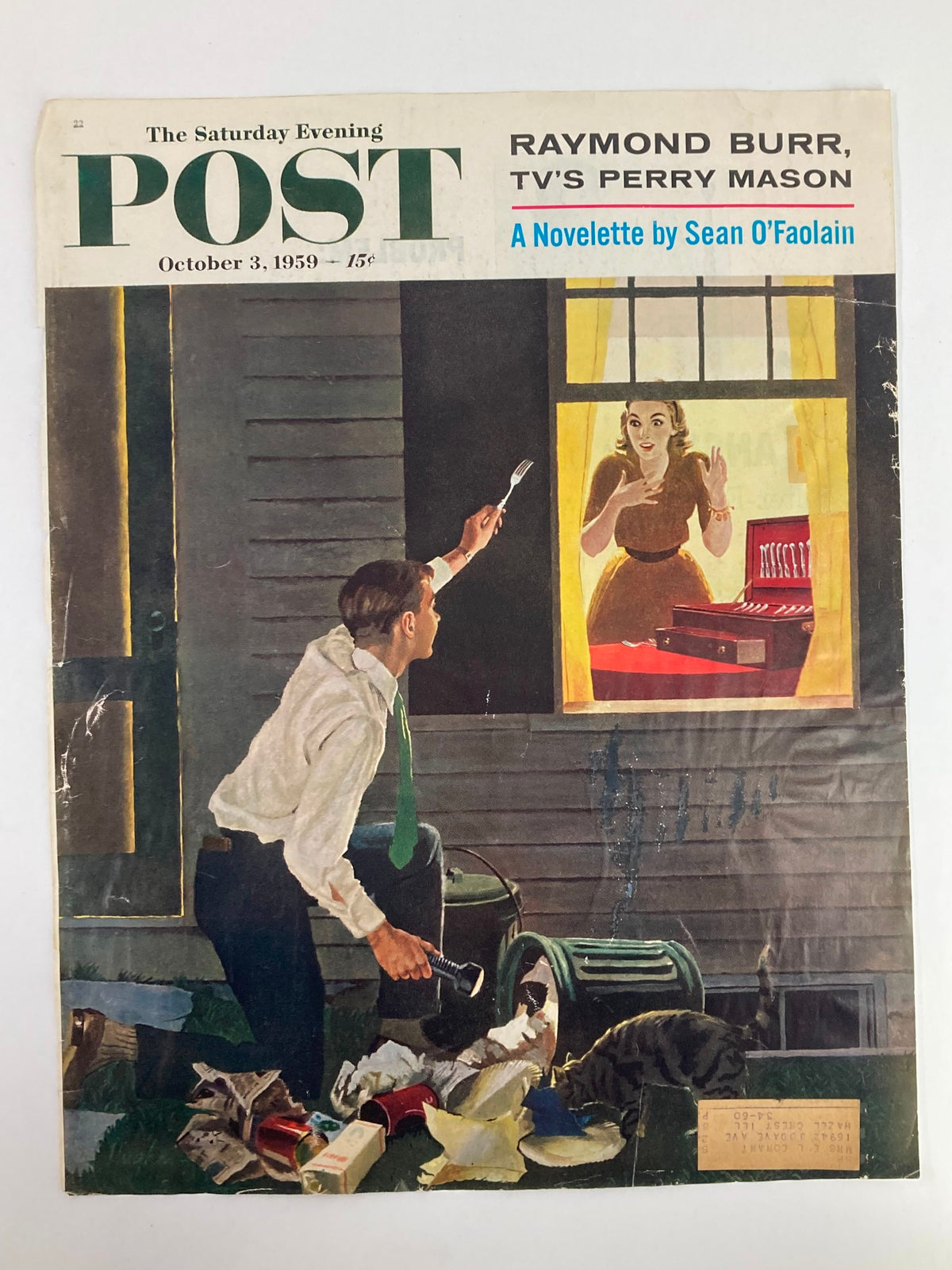 Cover of The Saturday Evening Post from October 3, 1959, displaying Raymond Burr as TV's Perry Mason. The artwork captures a tense moment with a man crouched beside a trash can, aiming a flashlight while a woman gestures from a window, making it a collectible piece for fans of classic television.