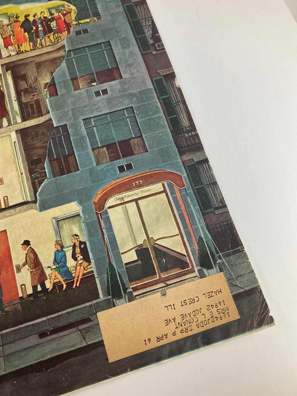 Close-up view of The Saturday Evening Post cover from February 25, 1961, highlighting the title 'Michigan: The Problem State' and intricate details of the building's front entrance and social gatherings.