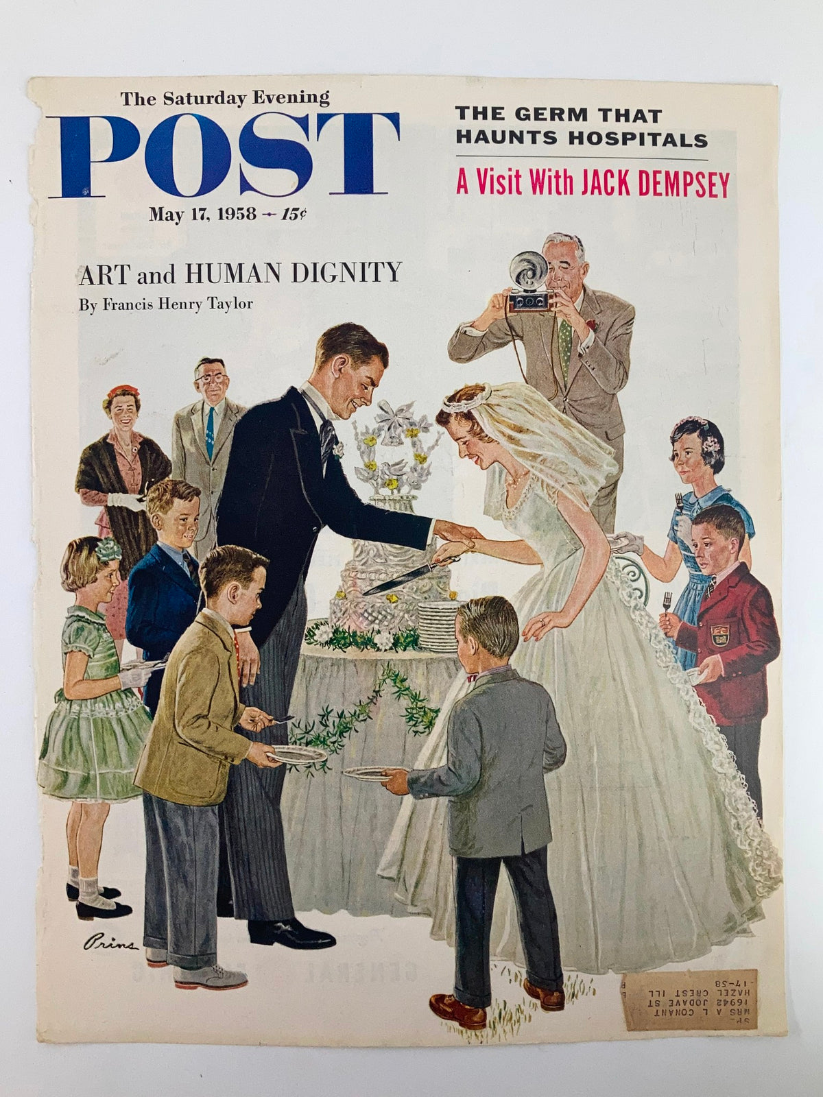 The Saturday Evening Post May 17, 1958 cover displaying 'A Visit with Jack Dempsey' with an illustrated scene of a wedding celebration including children serving cake.