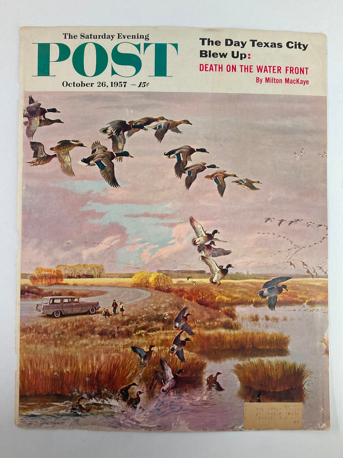 Cover of The Saturday Evening Post, dated October 26, 1957, titled 'Death on the Water Front', showcasing a scenic artwork of flying ducks above a serene landscape with a 1950s car and people enjoying the outdoors.