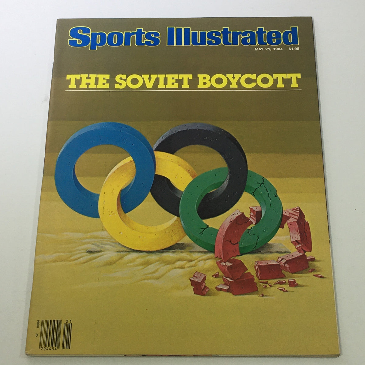 Cover of Sports Illustrated dated May 21, 1984, featuring 'The Soviet Boycott' with colorful Olympic rings and a sandy background, reflecting the impact of the Soviet Union's withdrawal from the Olympics.