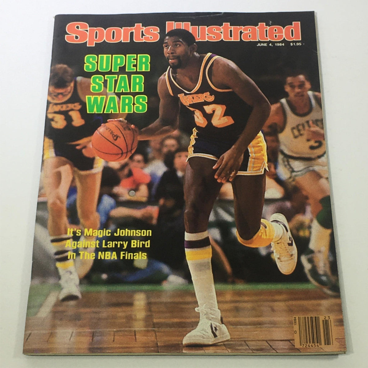 Sports Illustrated June 4 1984 magazine cover featuring Earvin 'Magic' Johnson during the NBA Finals against Larry Bird, titled 'Super Star Wars'. The cover highlights Magic Johnson in action wearing a Lakers jersey.