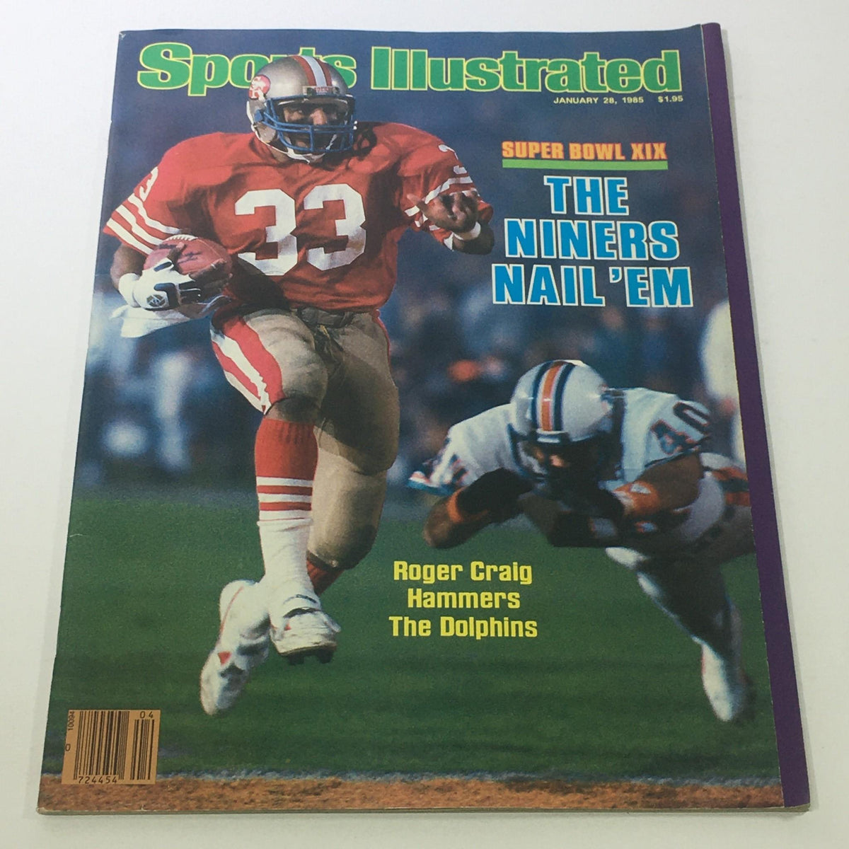 Cover of Sports Illustrated: January 28, 1985 featuring NFL star Roger Craig during Super Bowl XIX, showcasing him in action as he runs with the ball, with the headline 'THE NINERS NAIL'EM'.