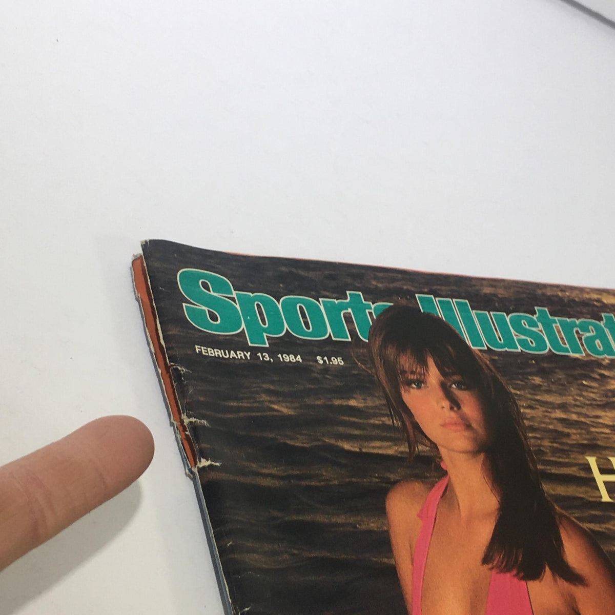 Close-up view of the Sports Illustrated cover dated February 13, 1984 with Paulina Porizkova, highlighting details of the vintage magazine and its title.