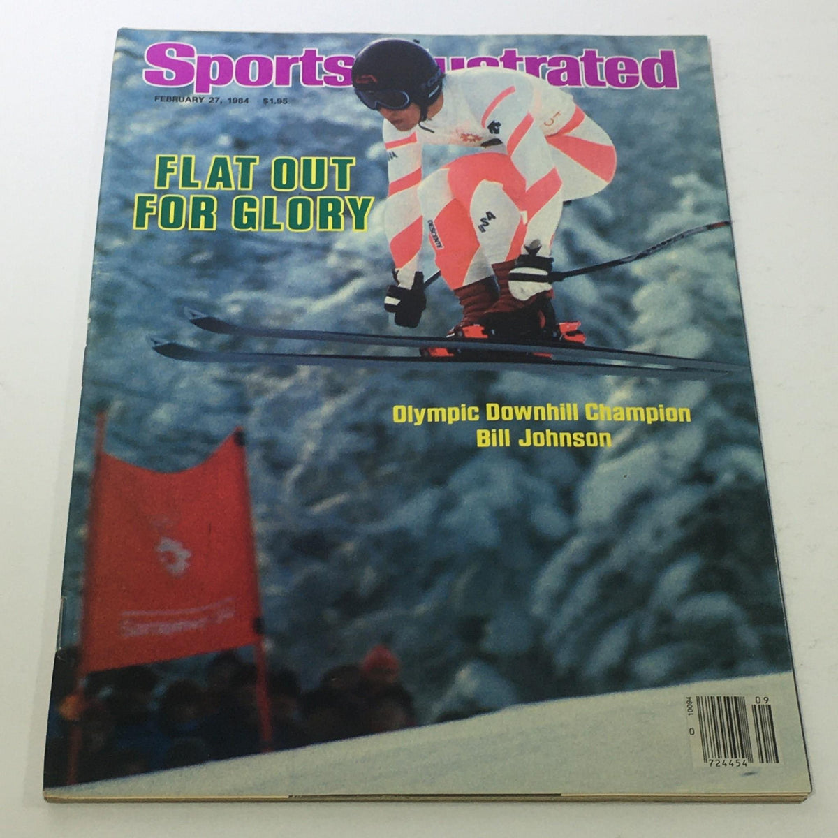 Cover of Sports Illustrated, February 27, 1984, featuring Olympic Downhill Champion Bill Johnson. The image shows Johnson skiing downhill on a snowy slope, capturing the thrill of winter sports.