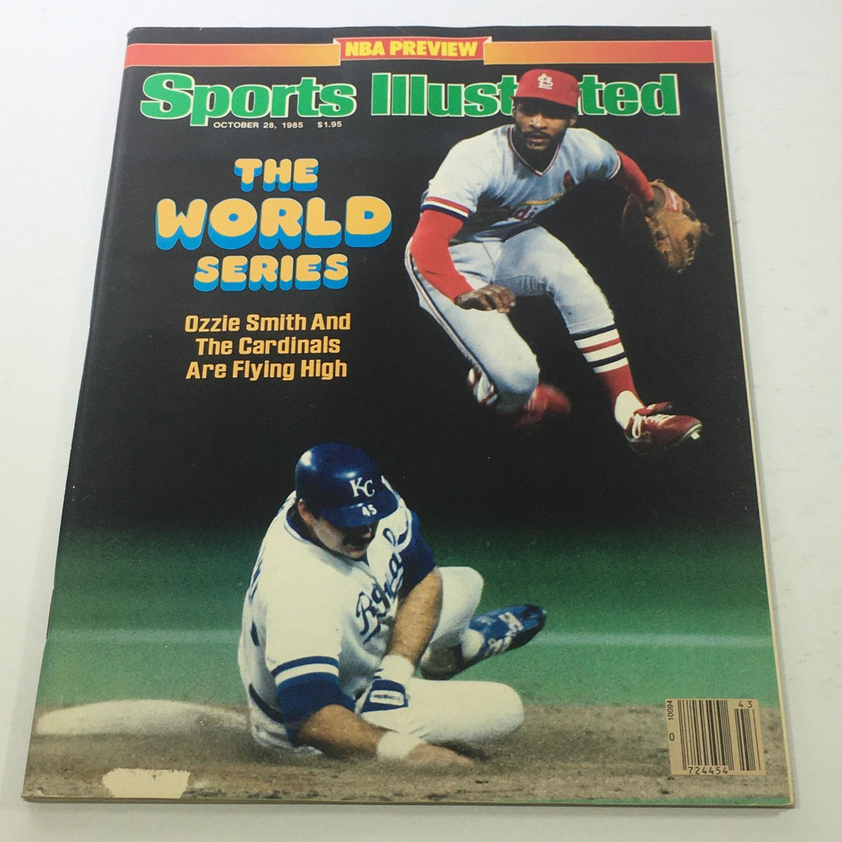 Cover of Sports Illustrated: October 28 1985 showcasing MLB star Ozzie Smith and a St. Louis Cardinals player in action during the World Series. Features dynamic sports photography and highlights the excitement of a pivotal era in baseball.