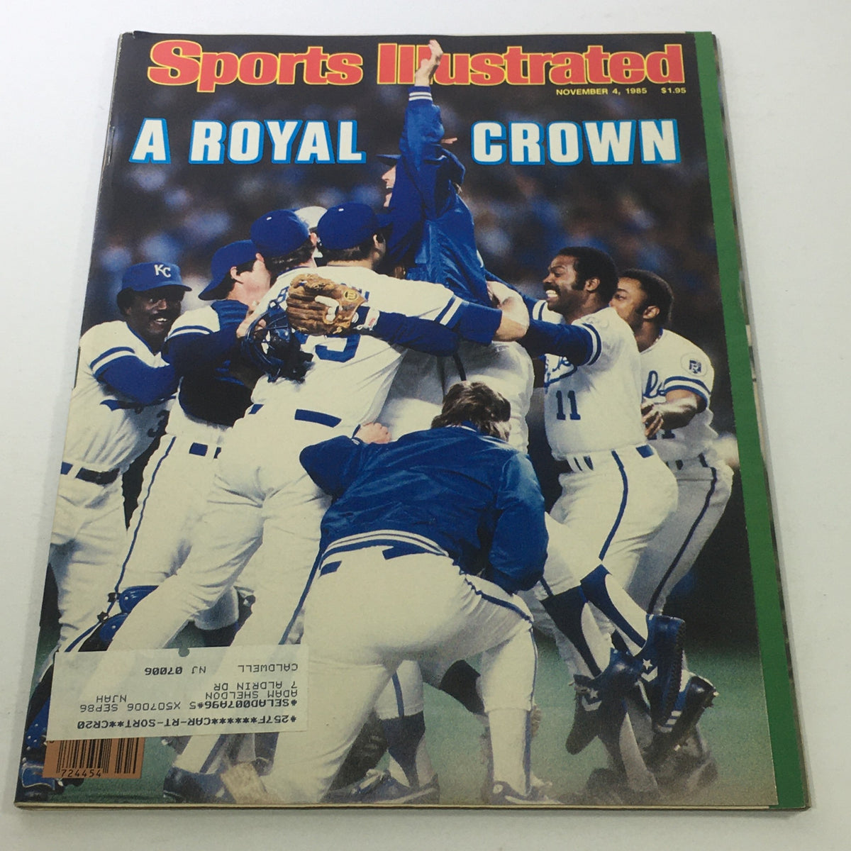 Cover of Sports Illustrated from November 4, 1985, featuring the Kansas City Royals celebrating their victory, titled 'A Royal Crown'. This vintage magazine captures a pivotal moment in MLB history.