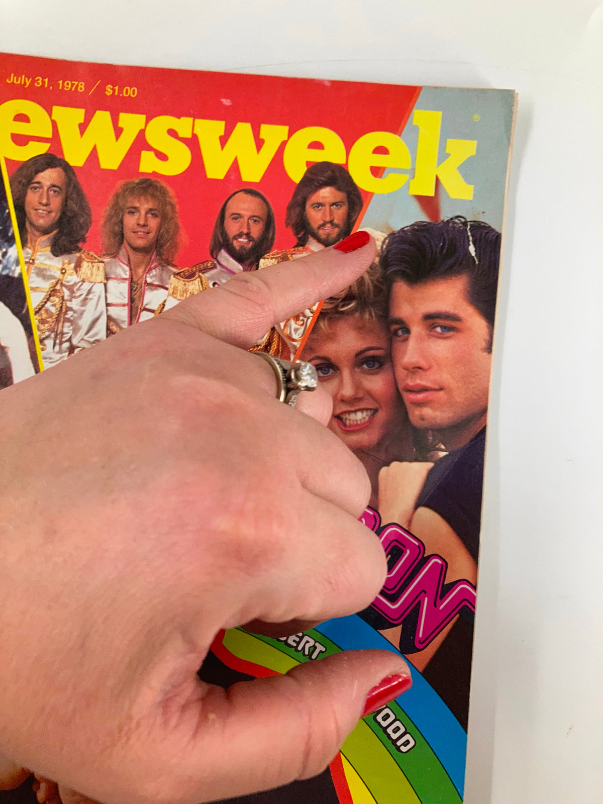 Detail of Newsweek Magazine cover dated July 31, 1978, showing Robert Stigwood and other musicians, highlighting the magazine's classic 70s design.