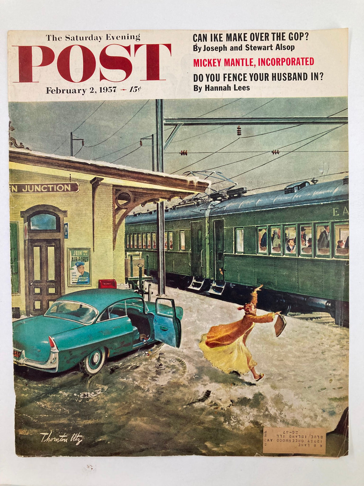 COVER ONLY The Saturday Evening Post February 2, 1957, depicting a snowy train station with a woman holding an umbrella and a classic car, capturing a moment in historical Americana with iconic vintage style.