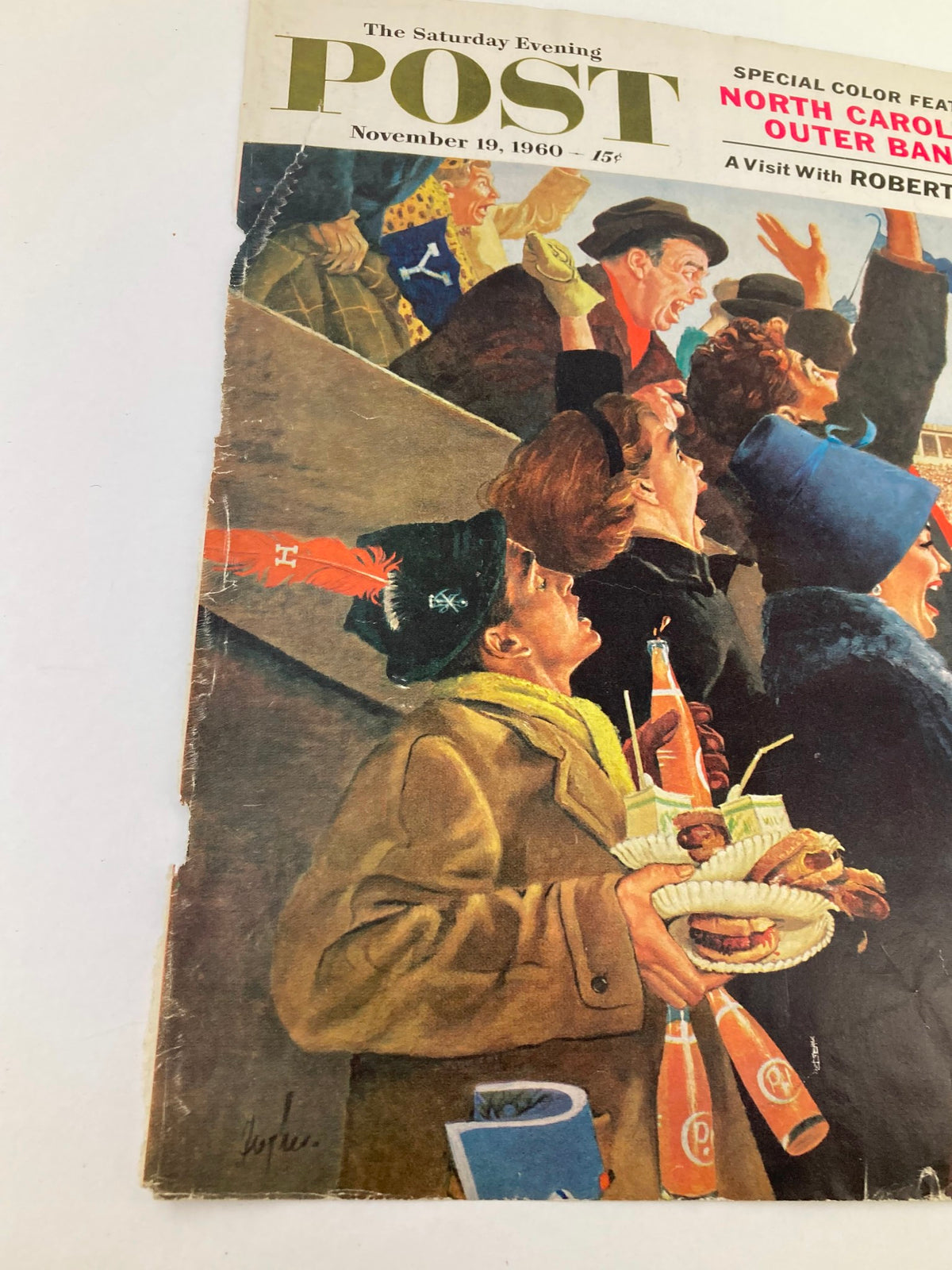 Cover of The Saturday Evening Post dated November 19, 1960, showcasing enthusiastic fans at a stadium, highlighting a visit with Robert Frost.