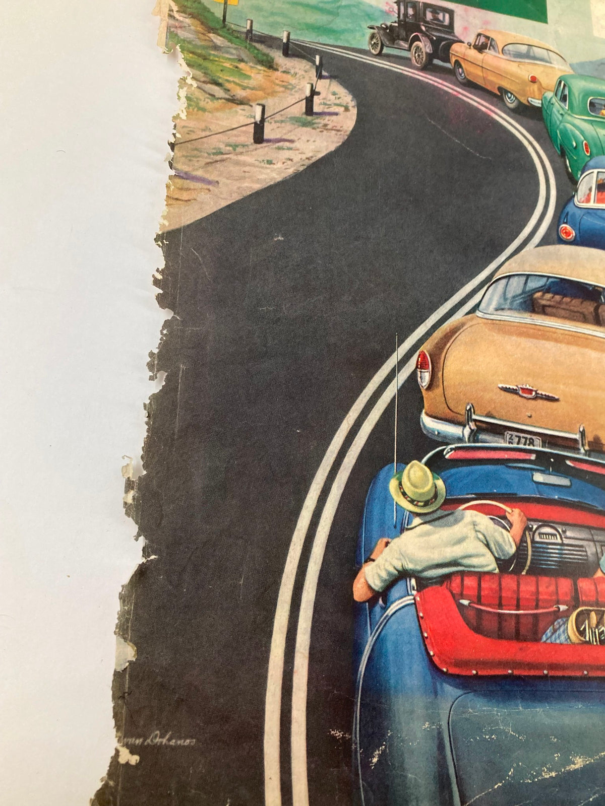 Close-up of a worn section of The Saturday Evening Post cover, October 9, 1954, titled 'I Flew My Mig To Freedom.' The scene features classic cars on a road with a visible 'No Passing' sign.