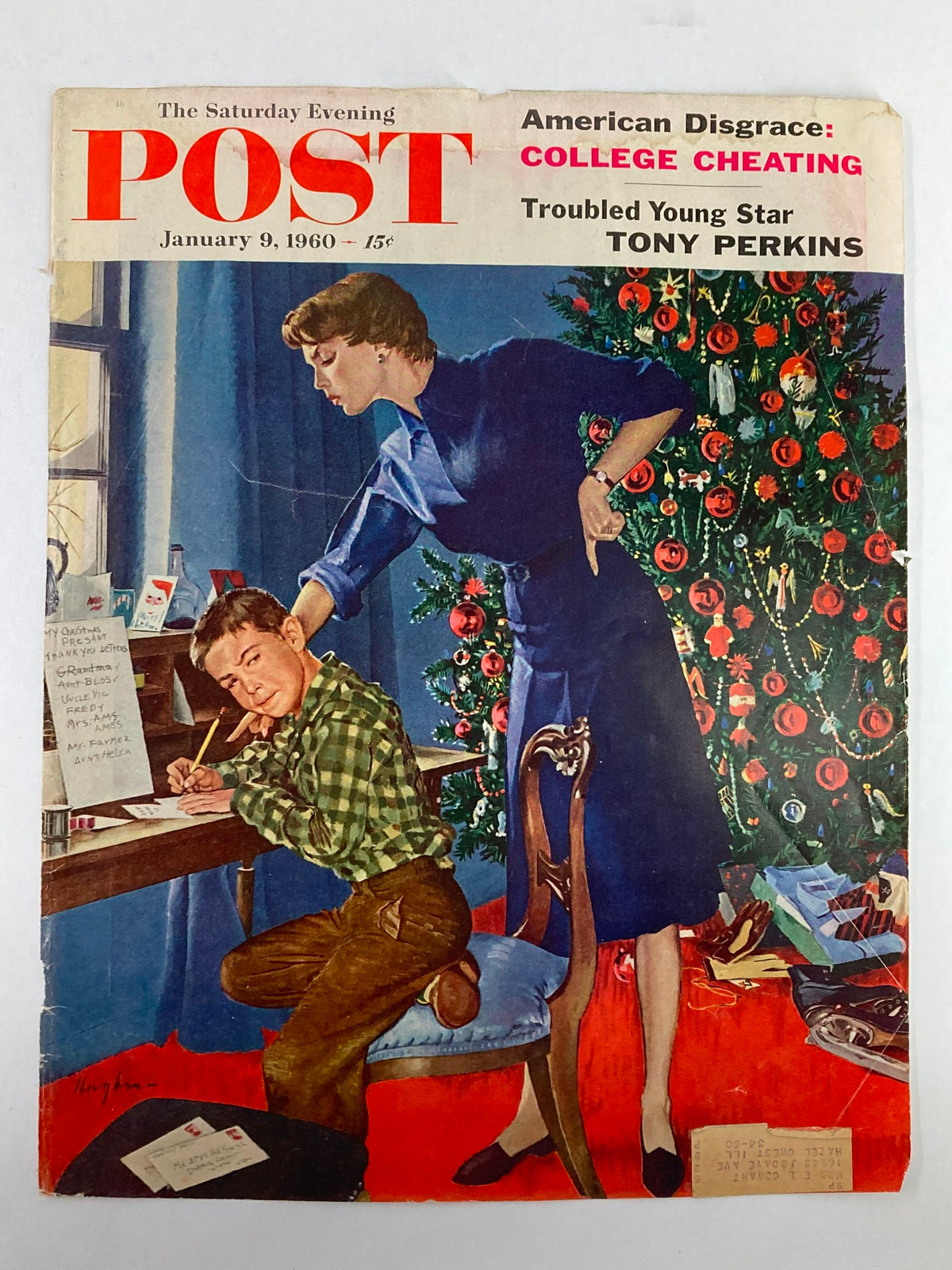 The Saturday Evening Post January 9, 1960 cover displaying Tony Perkins, featuring a young boy engaged in writing letters next to a decorated Christmas tree, emphasizing vintage nostalgia.