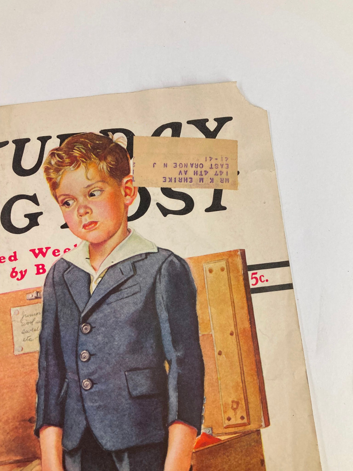 Close-up of the cover of The Saturday Evening Post from September 16, 1939, highlighting a young boy in a suit with an address label, representing historic merchandising themes.