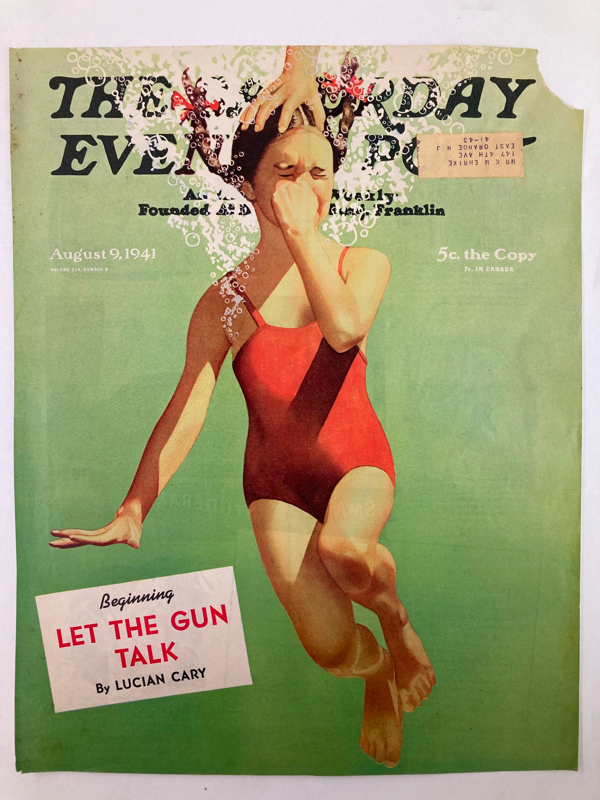 The Saturday Evening Post cover dated August 9, 1941, titled 'Let The Gun Talk,' depicting a girl in a red bathing suit with water splashes, showcasing classic 1940s art style.