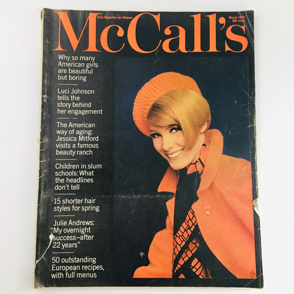 Cover of McCall's Magazine March 1966 featuring an elegant woman in an orange hat and coat, with headlines about Luci Johnson, Julie Andrews, and Jessica Mitford.