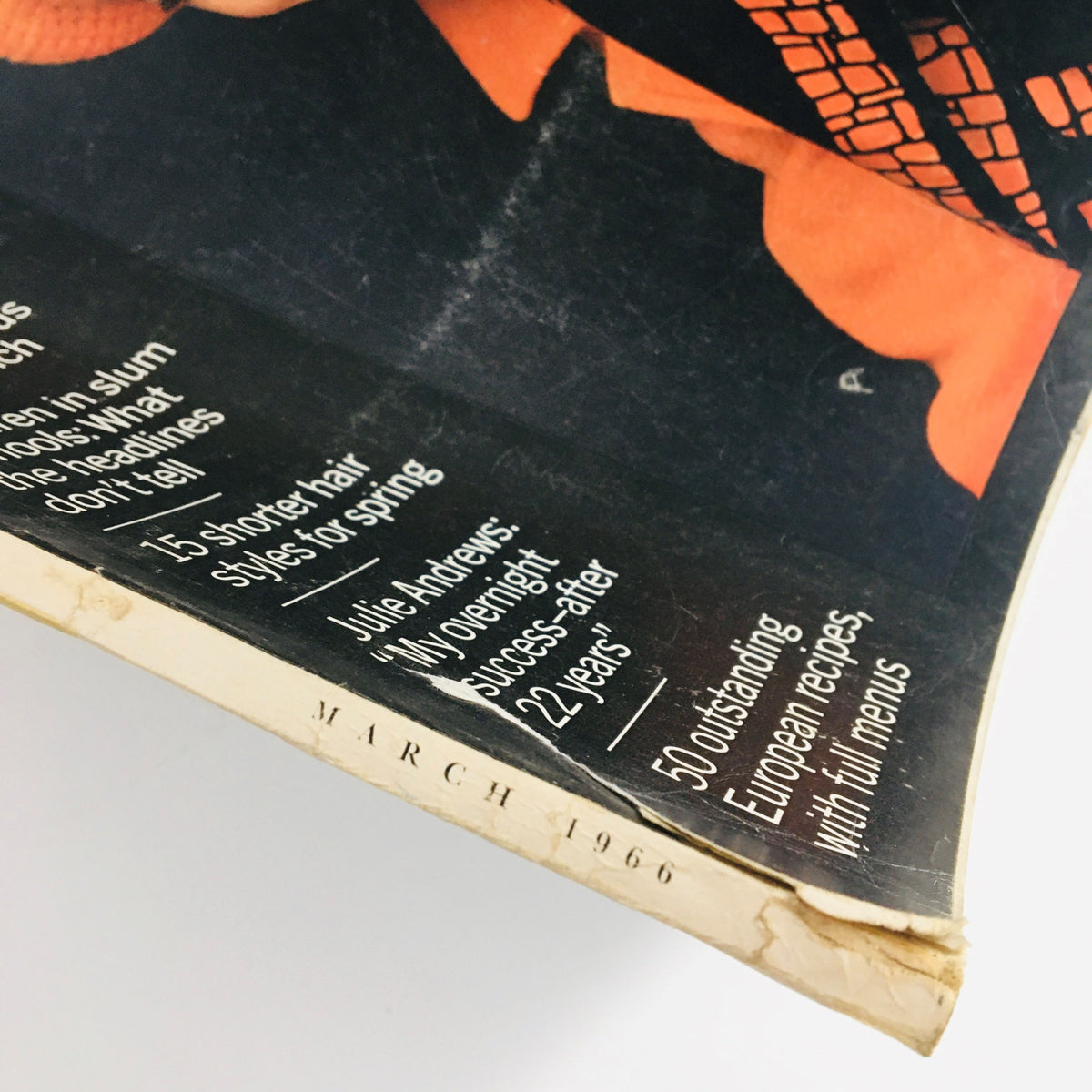 Corner detail of the McCall's Magazine March 1966 displaying the publication date and list of standout articles, including European recipes.