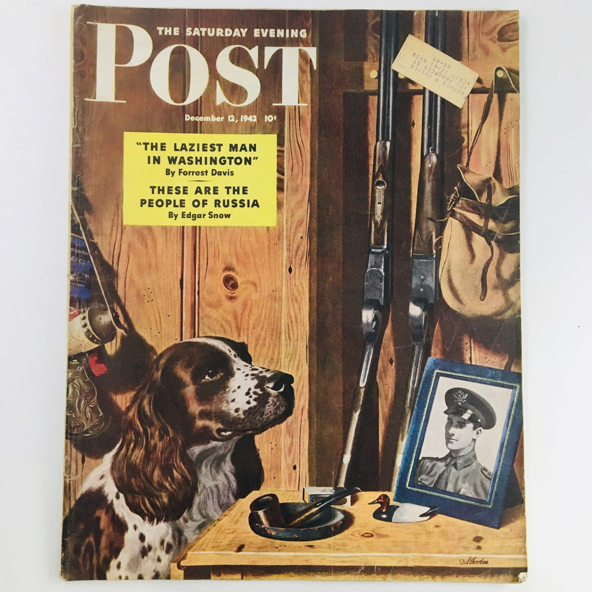 Cover of The Saturday Evening Post from December 12, 1942, featuring an illustration titled 'The Laziest Man in Washington' by Forrest Davis, showcasing a dog alongside rifles and a framed photo. Highlights include articles by Edgar Snow.