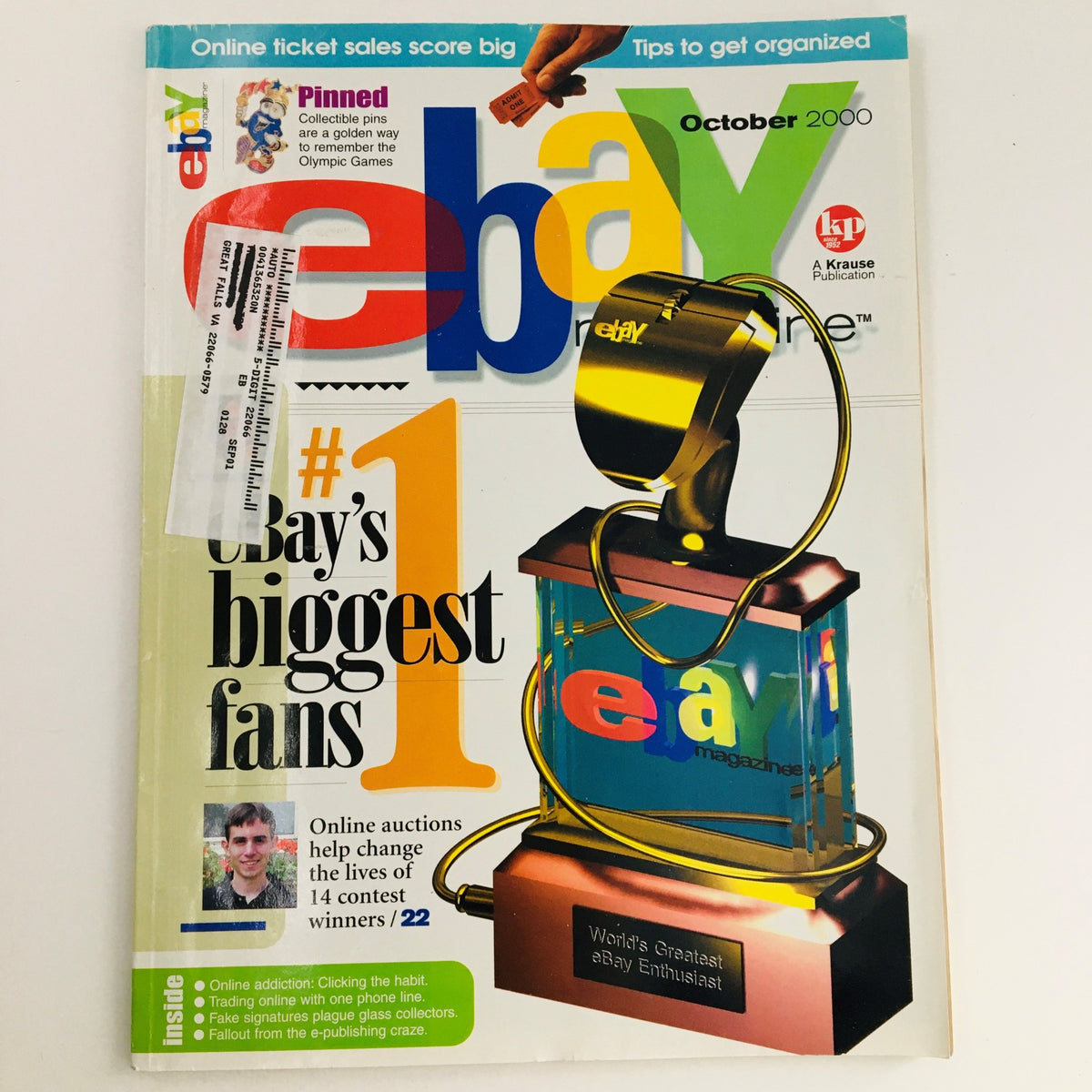 Cover of eBay Magazine, October 2000, featuring a trophy design and highlighting the theme 'Online Auctions Change Lives & eBay Enthusiast'.