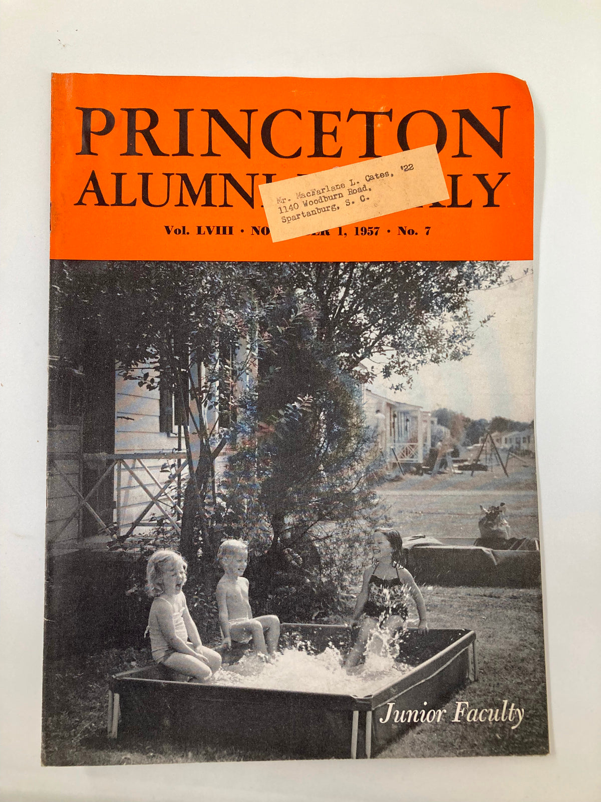 Cover of VTG Princeton Alumni Weekly November 1 1957 featuring junior faculty enjoying a poolside day with children playing, showcasing a nostalgic glimpse into the collegiate life at Princeton University.