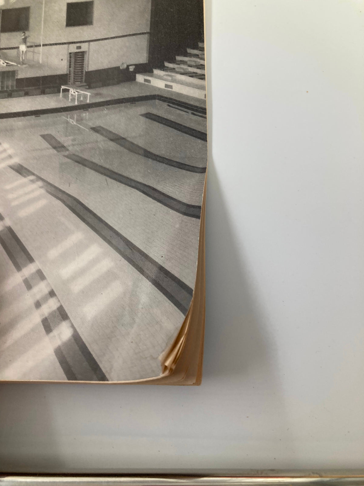 Side view of VTG Princeton Alumni Weekly September 24 1948 showcasing the Dillon Gymnasium Swimming Pool, highlighting the vintage magazine's worn edges and historical character.