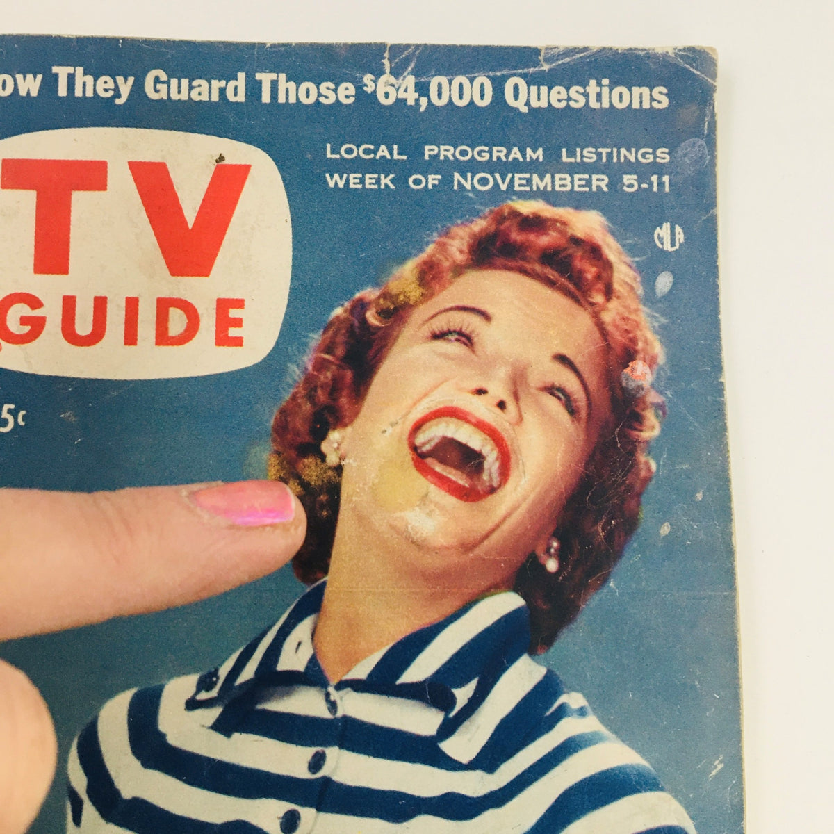 Close-up of the TV Guide Magazine November 5 1955 cover highlighting American actress Nanette Fabray's cheerful expression, with a finger pointing at her image, emphasizing nostalgic television history.