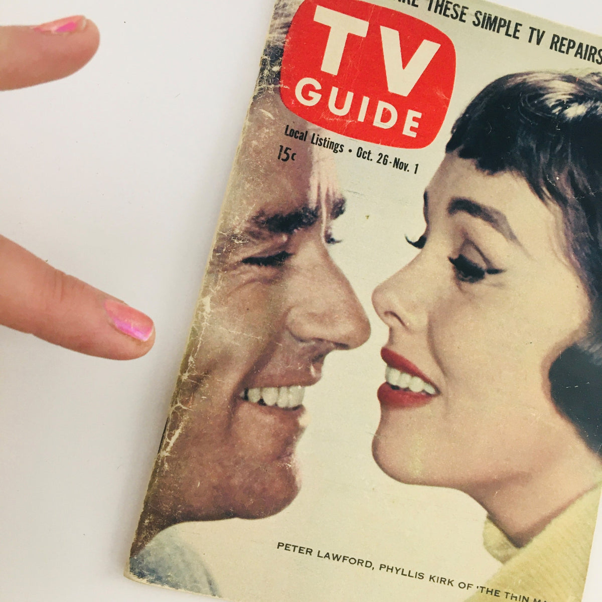 Cover of TV Guide Magazine October 26 1957 showcasing Peter Lawford and Phyllis Kirk with a vintage aesthetic.