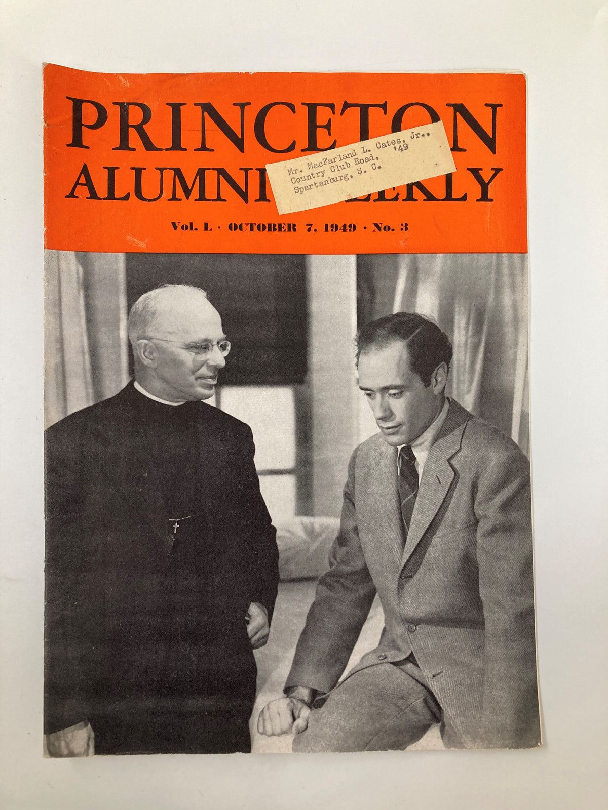 Cover of the VTG Princeton Alumni Weekly dated October 7, 1949 featuring Rev. Robert Dunn, an Episcopalian Minister. The cover shows two individuals, one in clerical attire and another in a suit, highlighting historical insights from Princeton University.