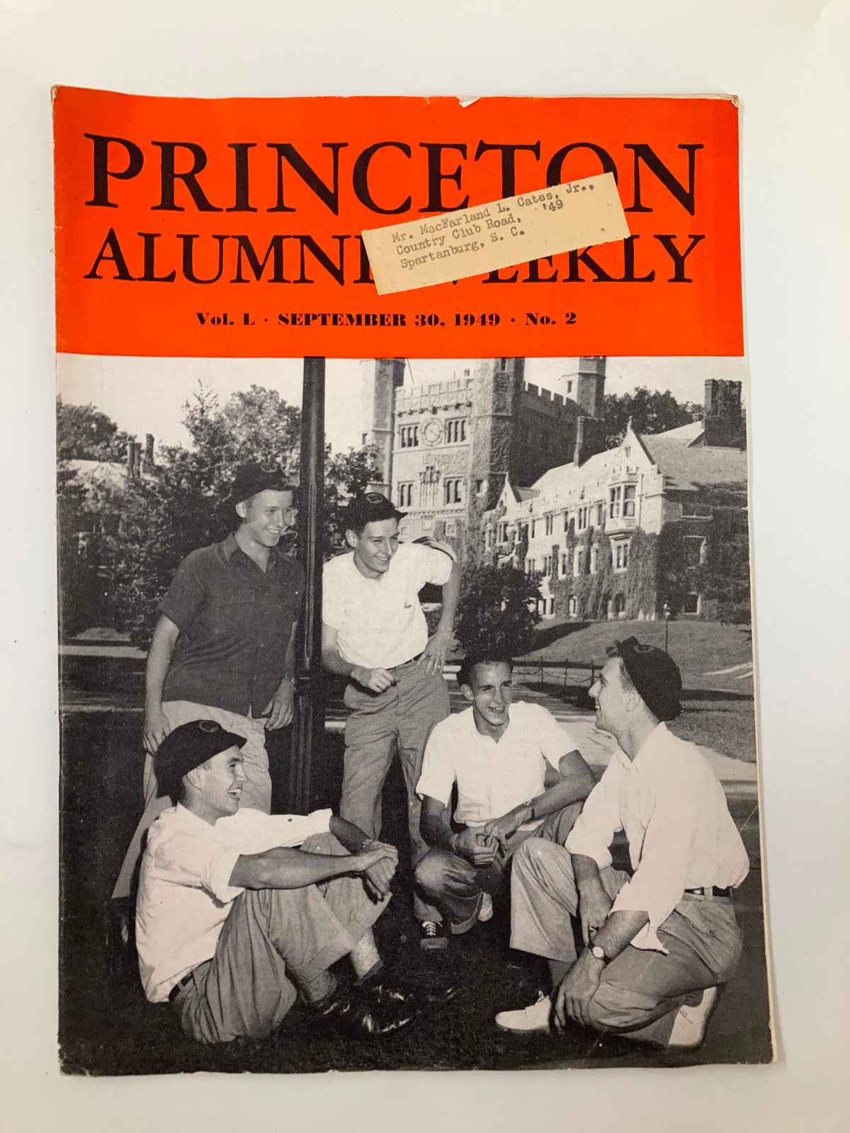 Cover of VTG Princeton Alumni Weekly September 30, 1949 featuring a group of five men in casual attire smiling and interacting outdoors, with Princeton University buildings in the background.
