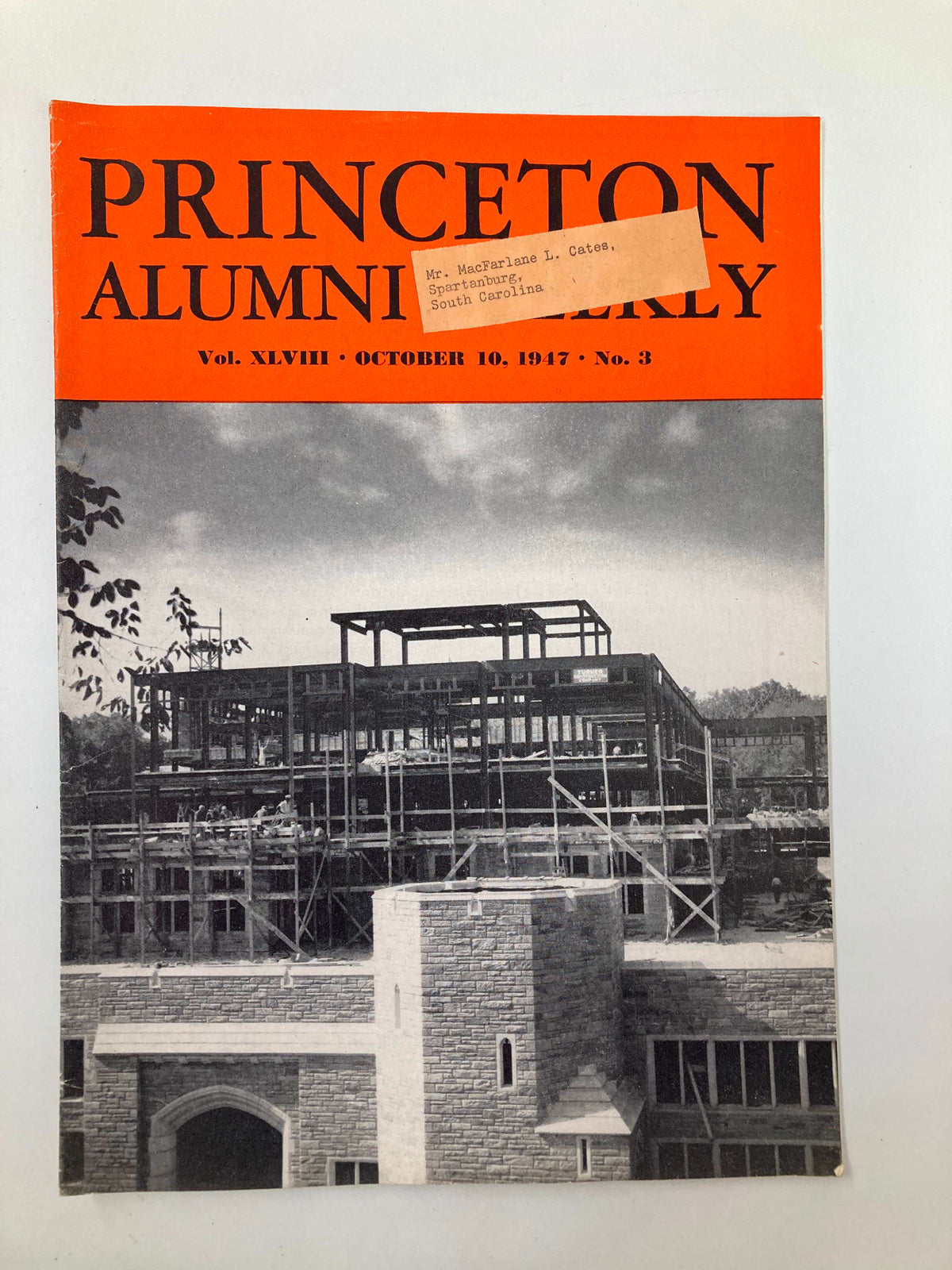 Cover of the VTG Princeton Alumni Weekly October 10, 1947, showcasing a vintage design with a construction site in the background, featuring a label indicating Mr. MacFarlane L. Cates from Spartanburg, South Carolina.