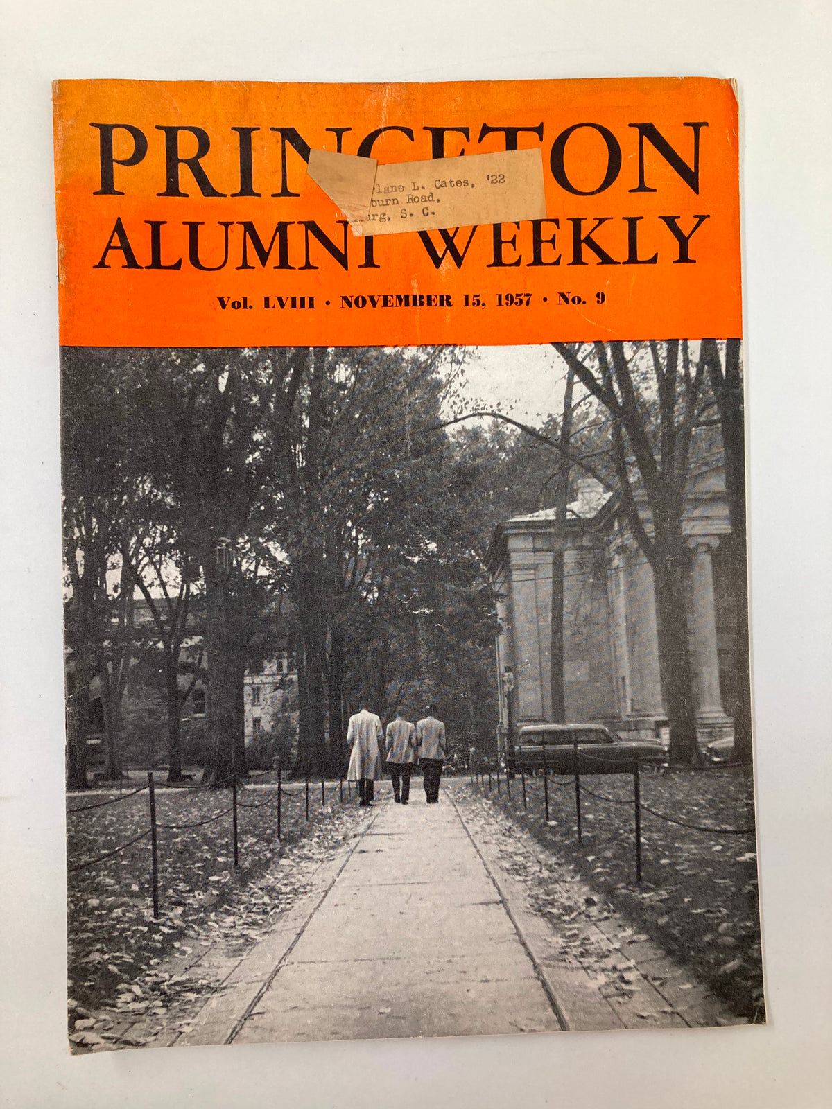 Cover of VTG Princeton Alumni Weekly November 15, 1957, featuring three figures walking on a path lined with trees, showcasing the magazine's title and issue information.