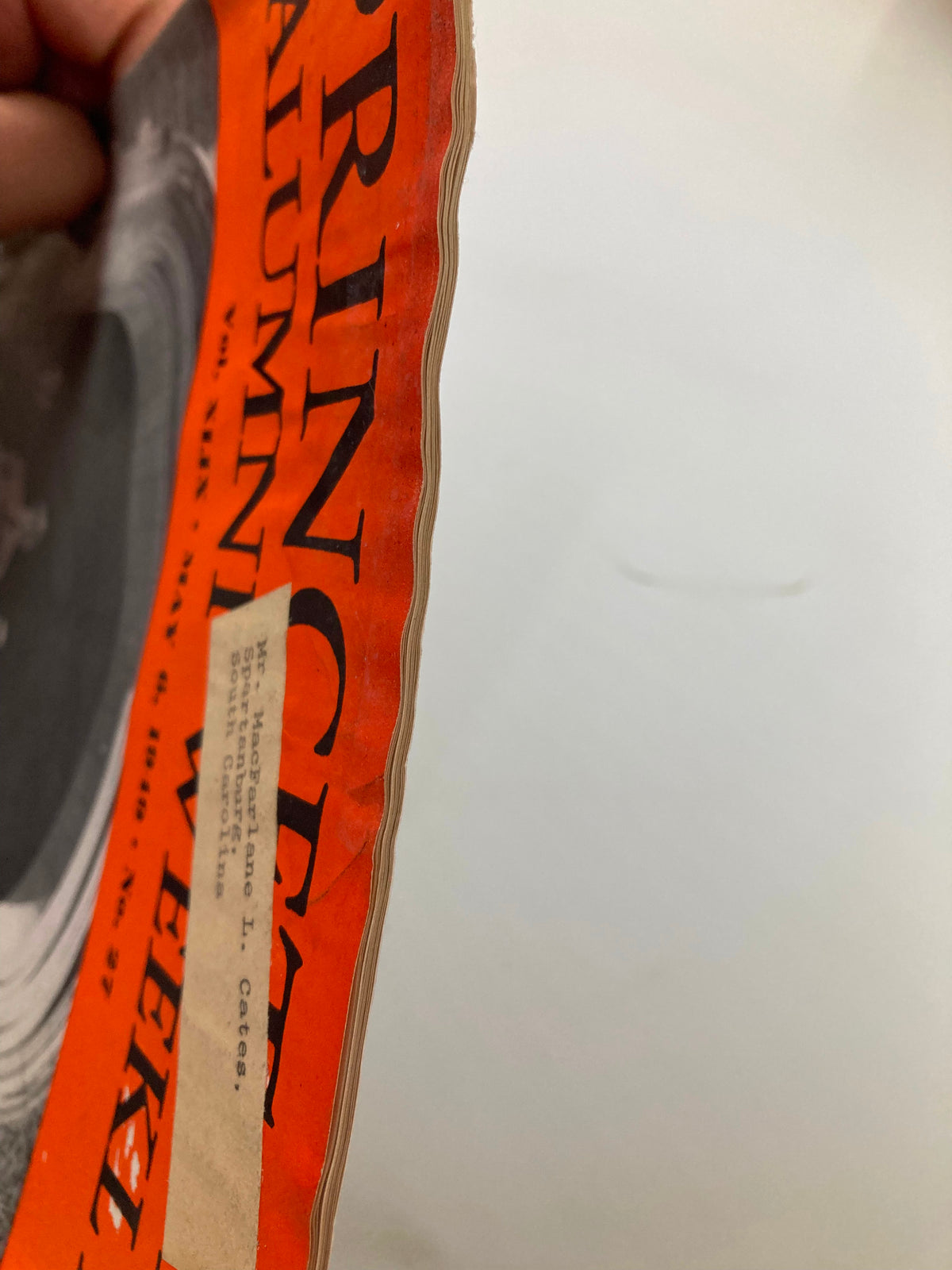 Close-up view of the edge of the VTG Princeton Alumni Weekly dated May 6, 1949, showing its vintage wear and a front label that highlights its collectible nature.