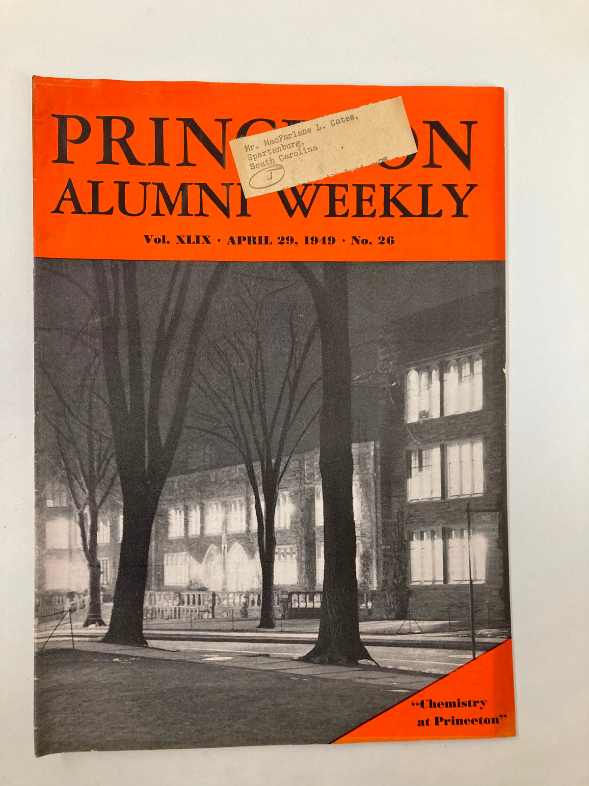 Vintage cover of the VTG Princeton Alumni Weekly dated April 29, 1949, featuring the orange and black title, with an image of a nighttime campus scene, including a label detailing the recipient's name and address.
