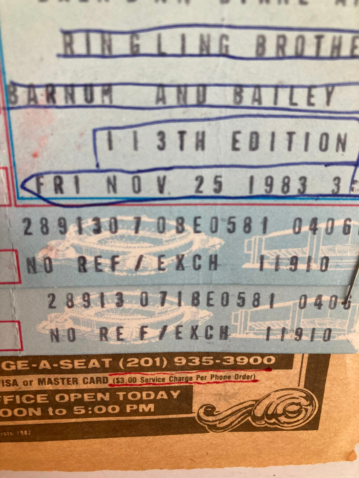 Close-up of the 1983 Souvenir Program for the Ringling Bros. and Barnum & Bailey, showcasing ticket details for the performance on November 25, 1983.