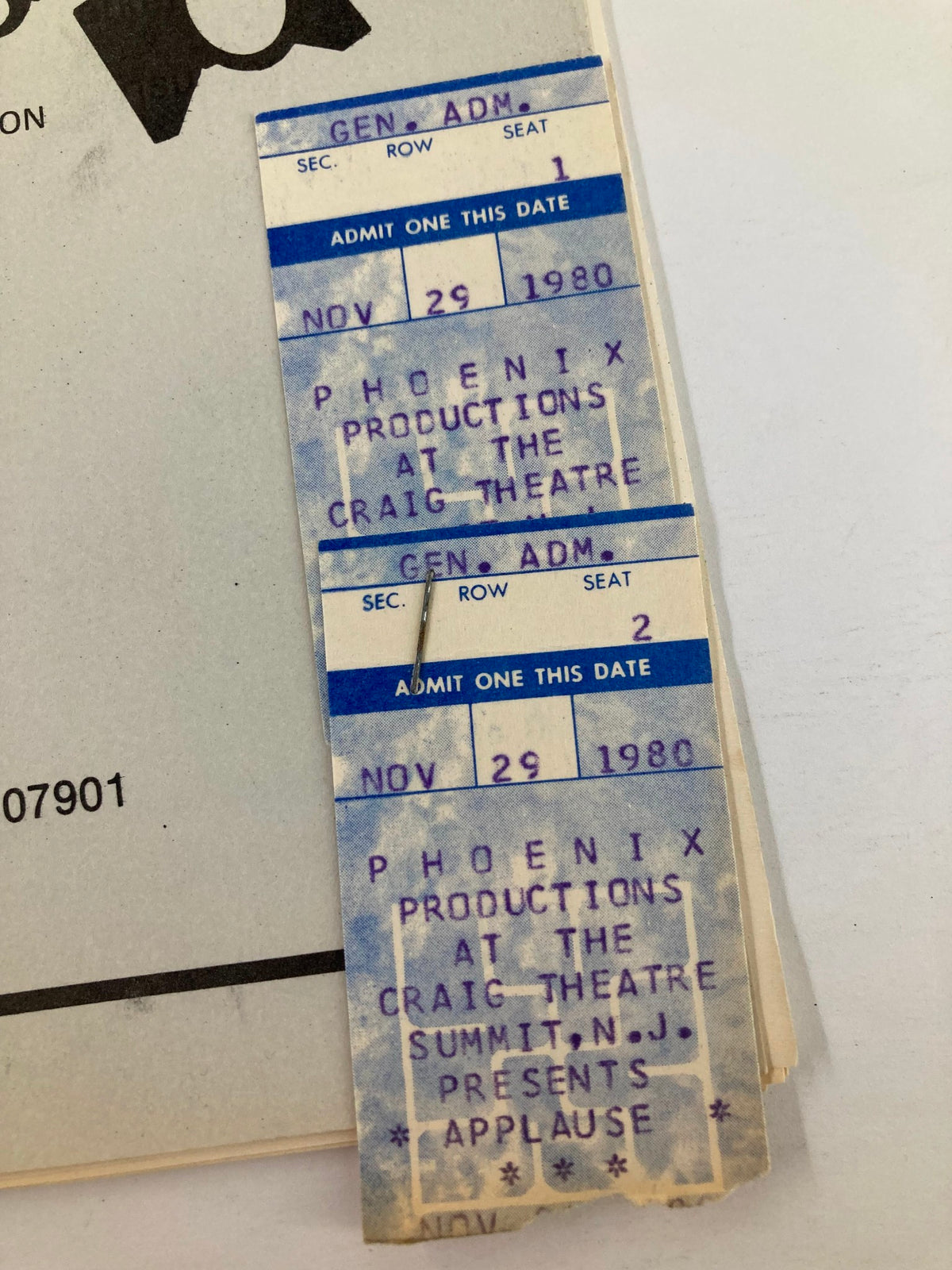 Close-up view of the ticket for the 1979 Program at The Craig Theatre, indicating admission for Phoenix Productions' presentation of Applause on November 29, 1980.