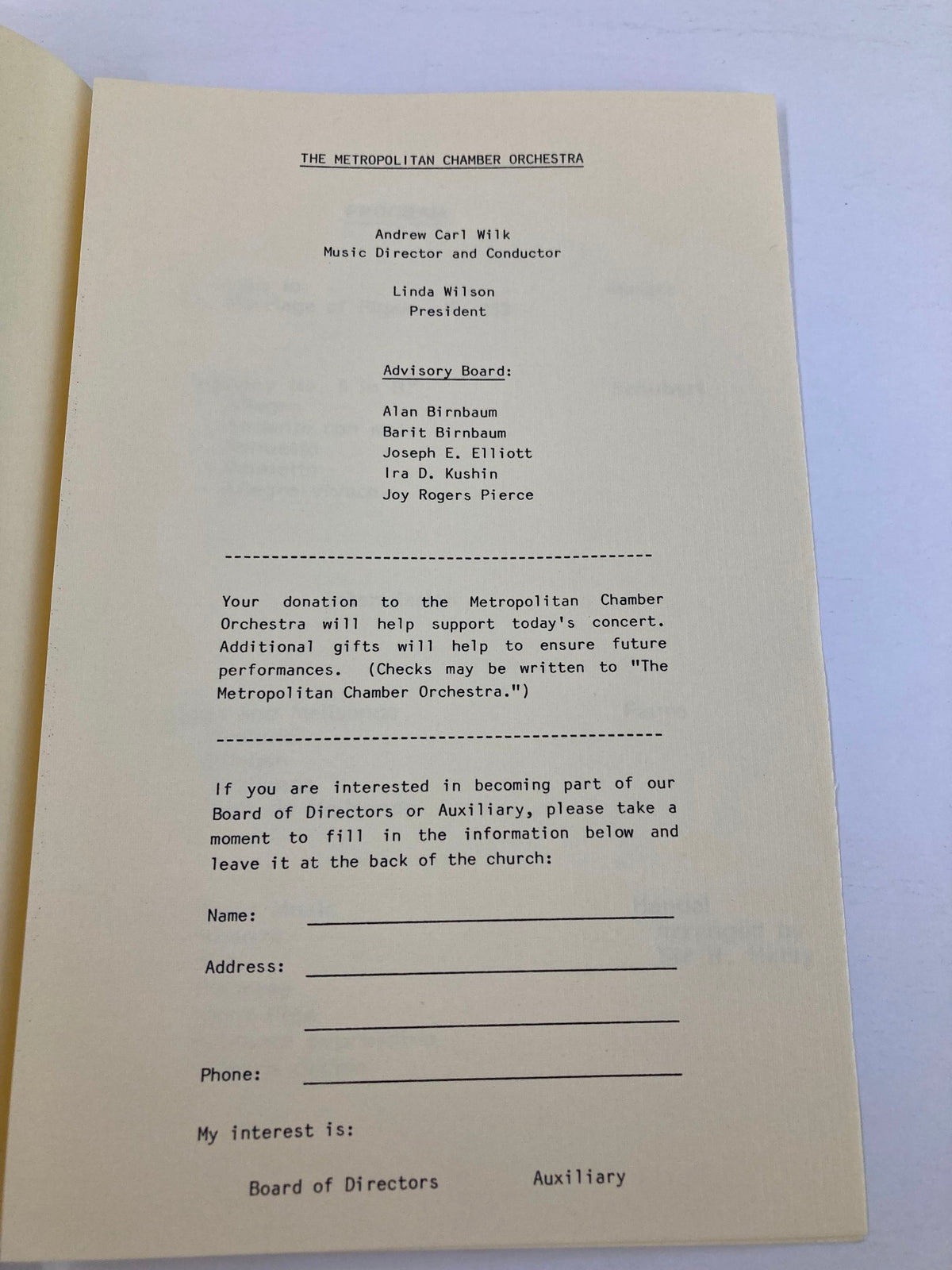 Inside page of the 1983 program for The Metropolitan Chamber Orchestra, detailing the music director Andrew Carl Wilk and the advisory board.