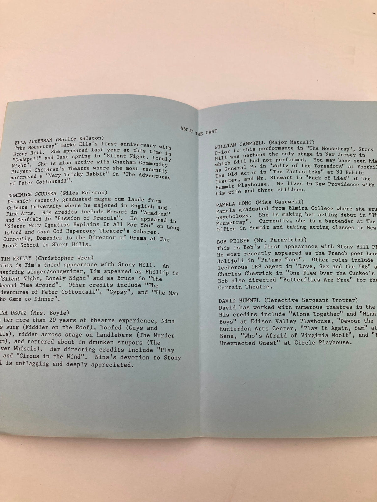 Inside pages of the 1987 program for The Mousetrap by Agatha Christie, featuring details about the cast and their roles, hosted at the American Legion Hall.