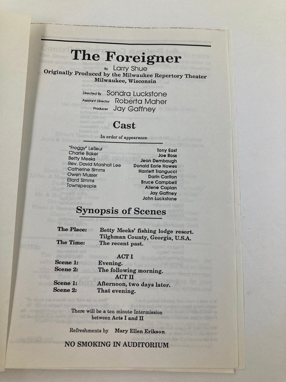 Inside page of the 1990 program for 'The Foreigner' by Larry Shue, detailing the cast and synopsis of scenes from the play.