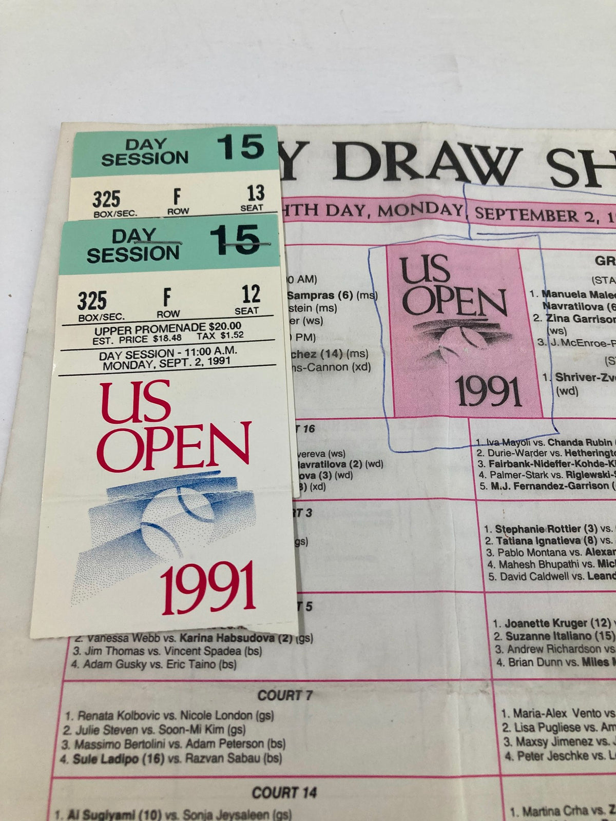 Close-up view of the 1991 Daily Draw Sheet Program USTA Open Women's Single Championship featuring tickets for Day Session 15, along with program highlights.