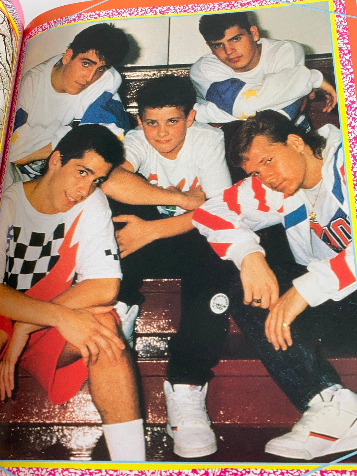 1990 New Kids On The Block Scrapbook by Grace Catalano, featuring a group photo of the iconic band members posing together on stairs, showcasing their distinctive 90s fashion.