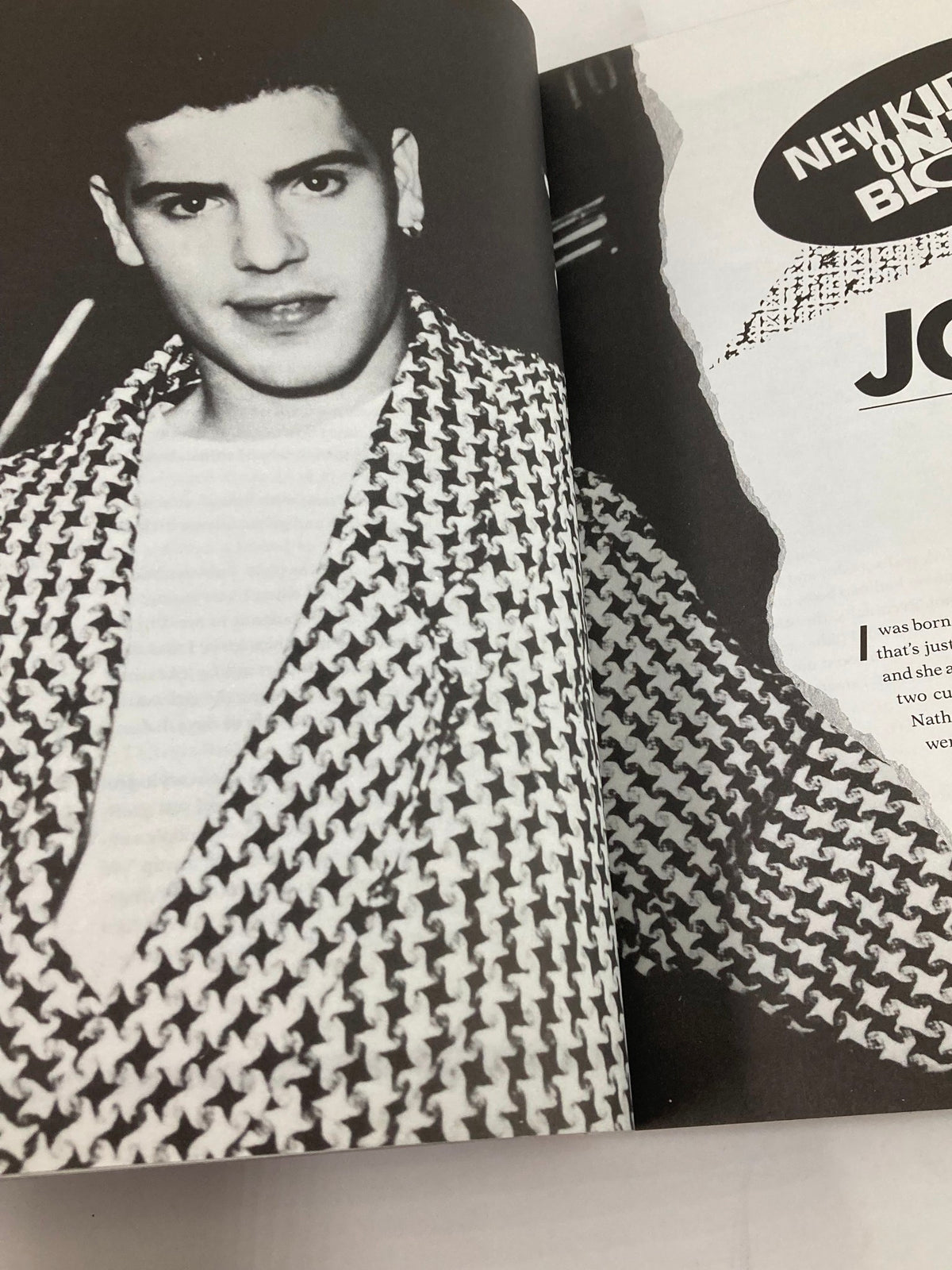 1988 The Official Autobiography Our Story New Kids On The Block - A black-and-white portrait of a young boy dressed stylishly, representing the early days of the New Kids On The Block.