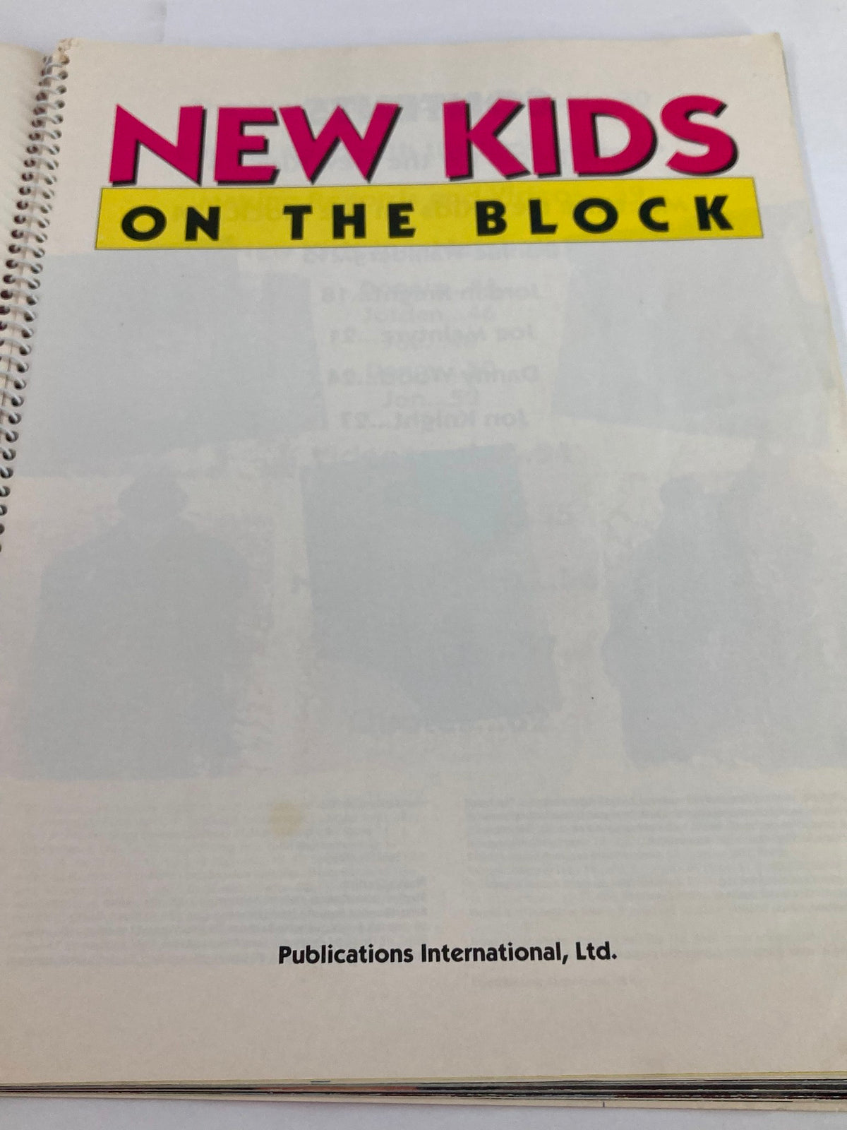Title page of '1990 Publications International, Ltd. Presents New Kids On The Block' showcasing the title prominently along with the publisher name, Publications International, Ltd.