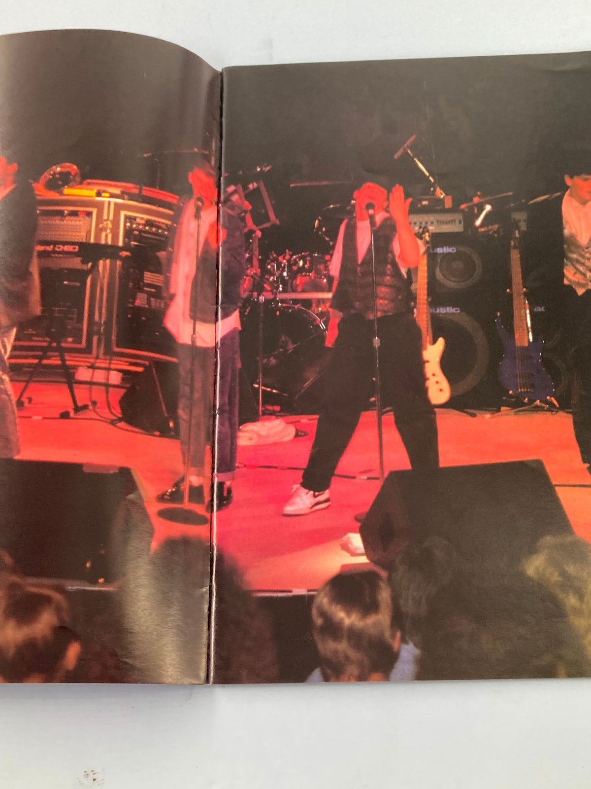 New Kids On The Block performing live on stage, captured in '1989 New Kids On The Block They'll Be Lovin' You Forever' book.