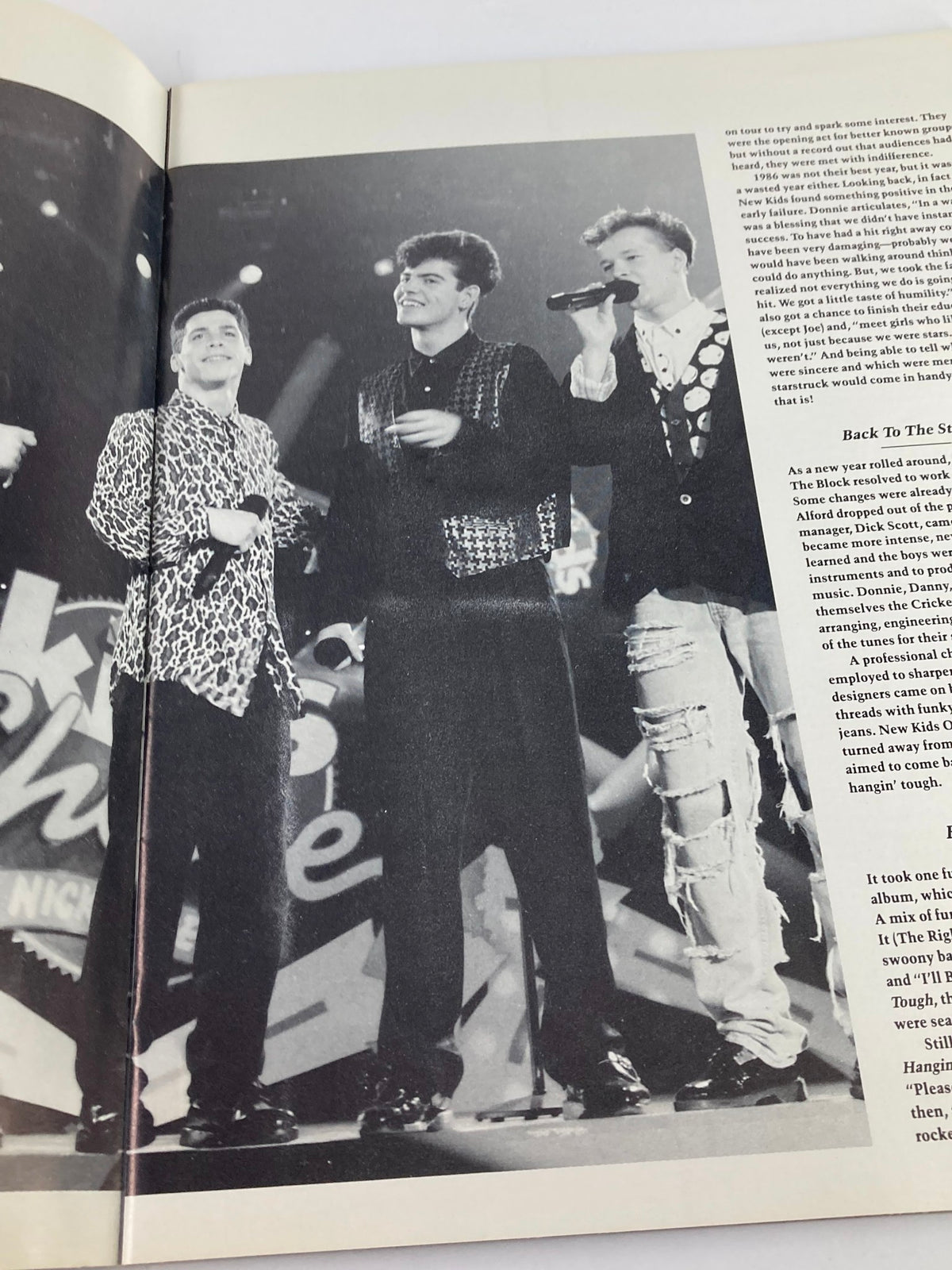 1989 New Kids On The Block They'll Be Lovin' You Forever - A performance image featuring three male singers in black attire on stage, embodying the energy of a live pop music event.