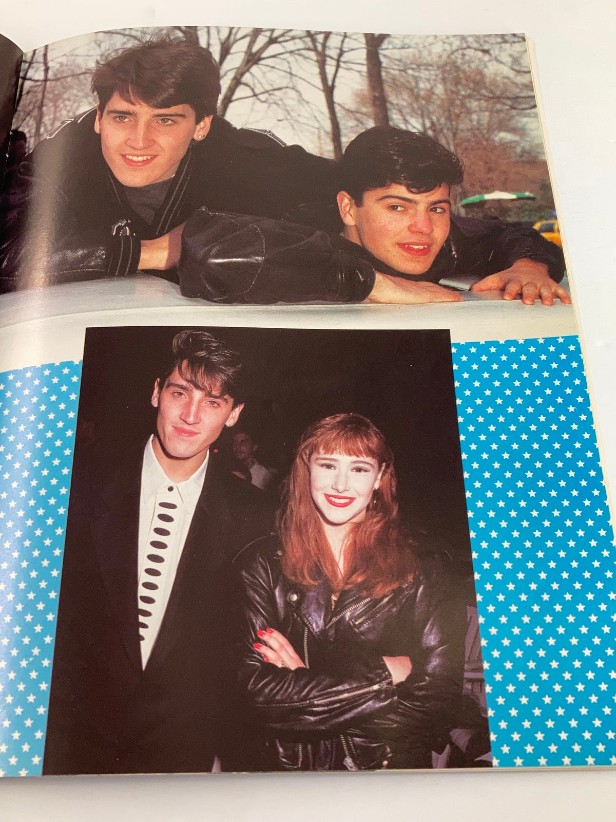 1989 New Kids On The Block They'll Be Lovin' You Forever - A photograph of two male pop stars and a female companion posing together, showcasing their edgy 80s fashion.
