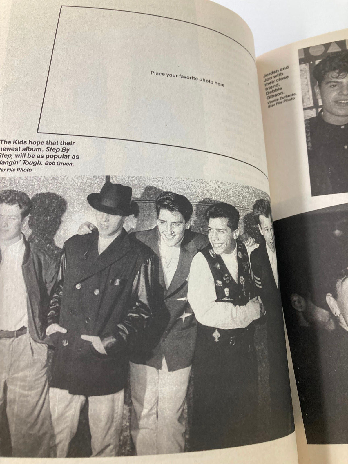 1990 New Kids on The Block Scrapbook by Anne M. Raso showing band members in stylish attire posing for a photo.