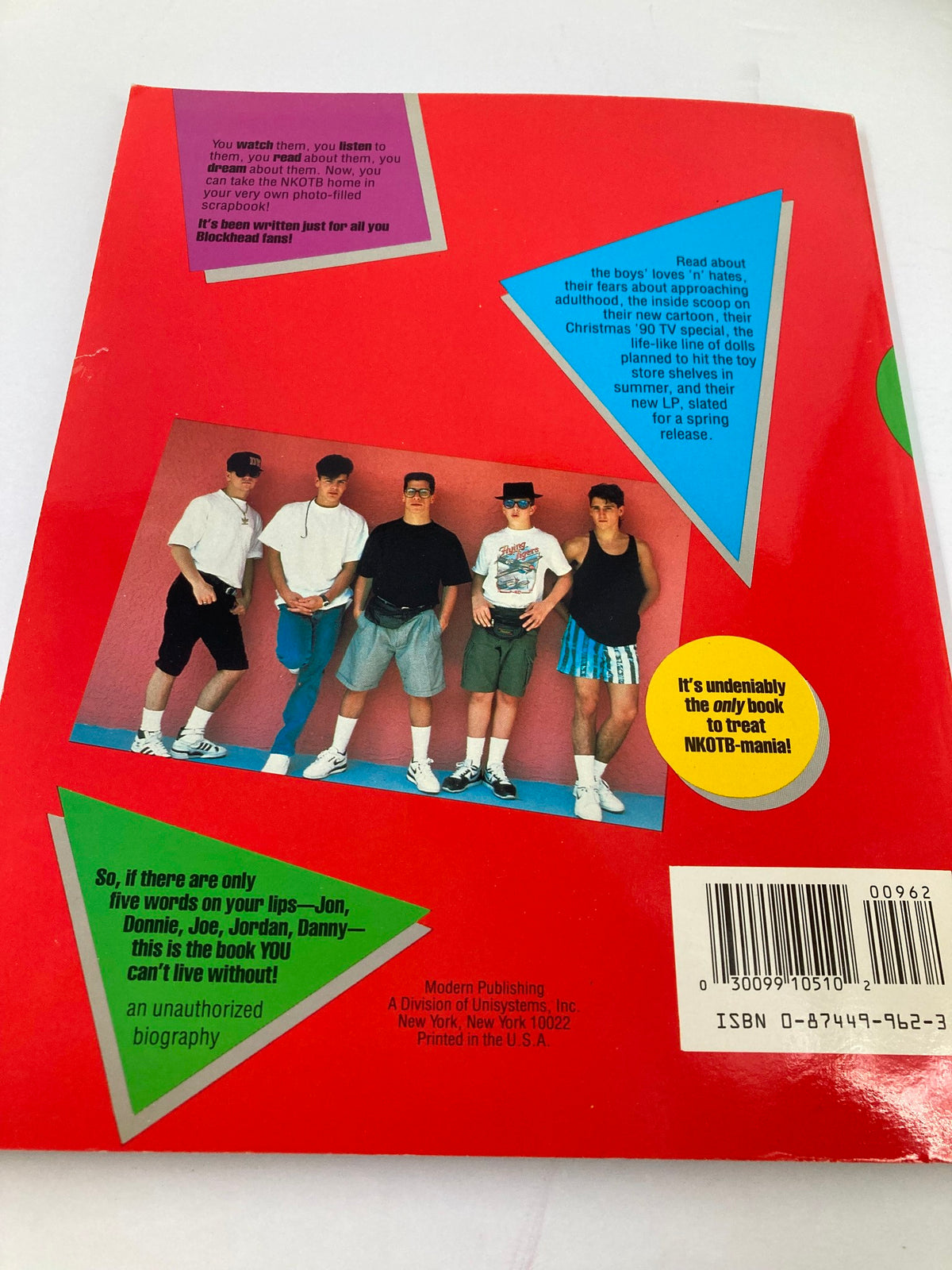 Back cover of '1990 New Kids on The Block Scrapbook by Anne M. Raso' featuring a photo of the band with colorful graphics.