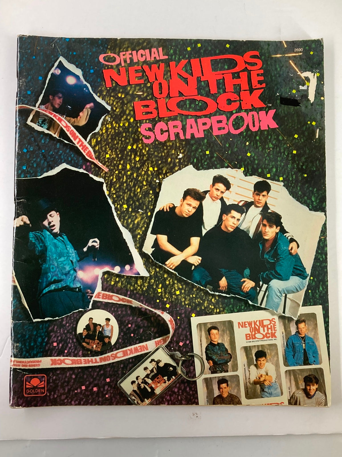 1989 Official New Kids on The Block Bonus Scrapbook cover featuring band members with a colorful background.