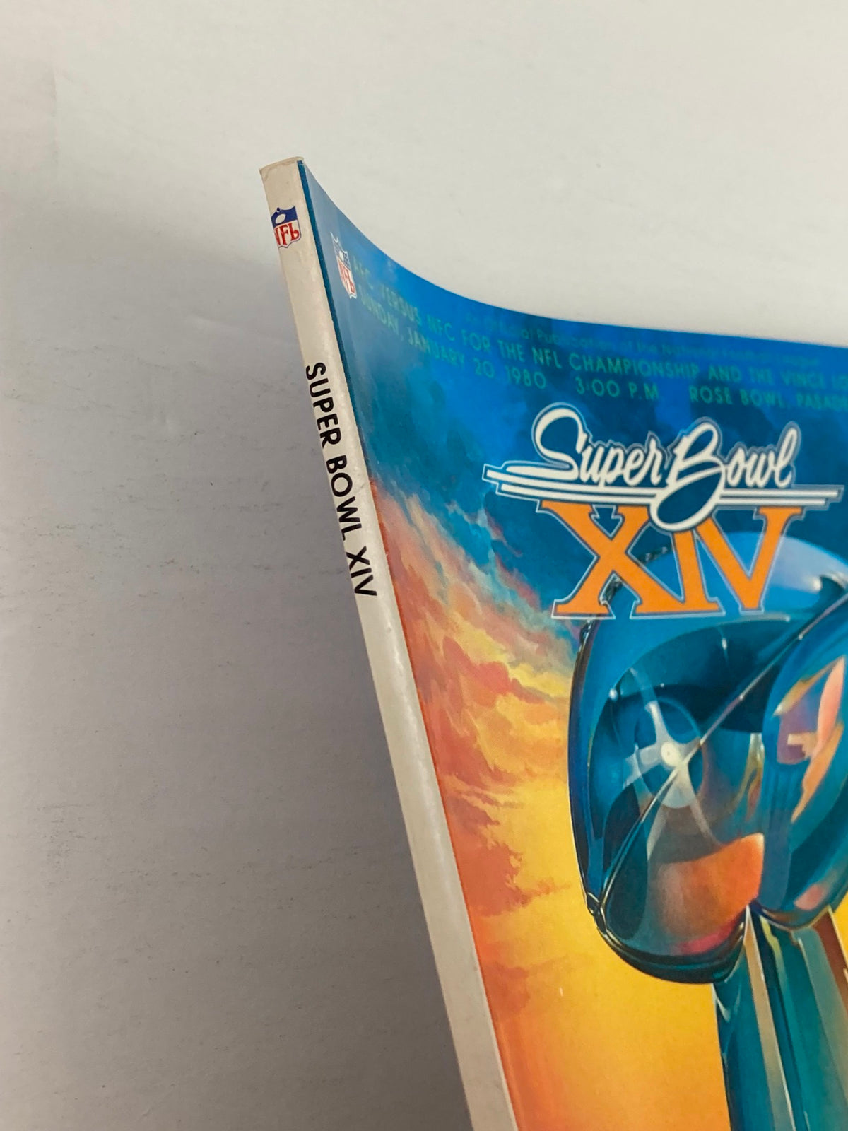 Cover of the 1980 NFL Super Bowl XIV Magazine featuring the Vince Lombardi Trophy design.